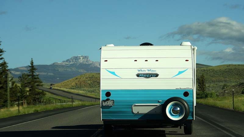 EV puling caravan on road