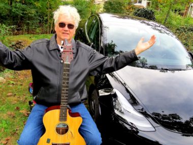 Rick Denzien shows off his Model 3 that drove almost 13,000km across American and back. Supplied.