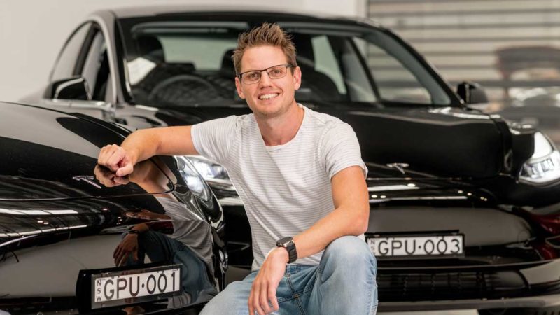 Daniel Rombouts with the new Tesla Model 3 rideshare cars. Supplied