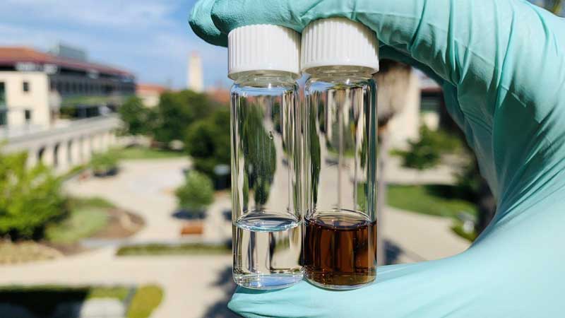 A conventional (clear) electrolyte on the left and the novel Stanford electrolyte of the right.
