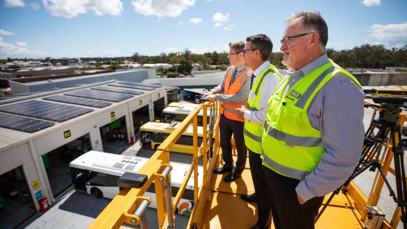 Transdev Australasia Head of Engineering Marc Cleave, TransLink CEO Matt Longland, Transdev Queensland Head of Business Operations Mark McKenzie looking at solar panel installation at Transdev’s Capalaba Depot, Brisbane