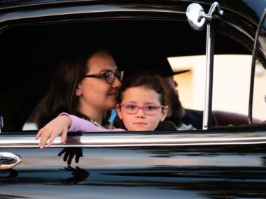 child sitting in traffic car