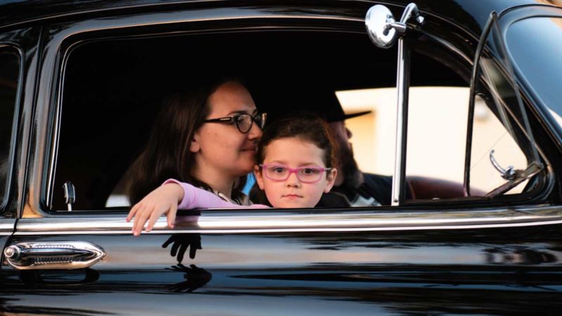 child sitting in traffic car