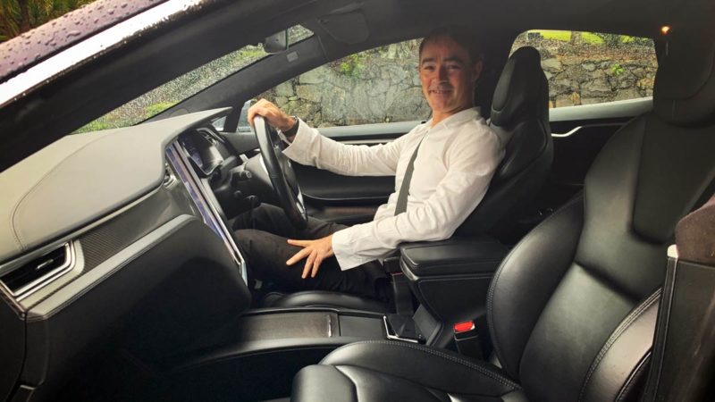 Nigel Raynard in his Tesla Model S.