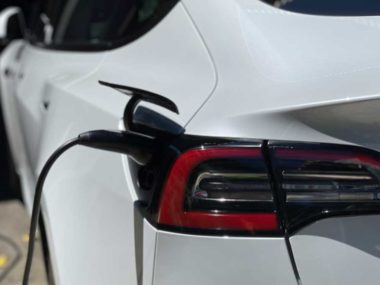 A Tesla electric car charging. Credit: Bridie Schmidt