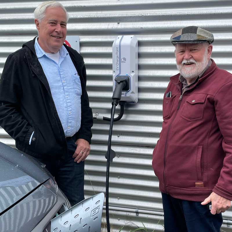Peter Pamment (left) and Graham Dempste (right) at Maple Street Co-op charger. Supplied