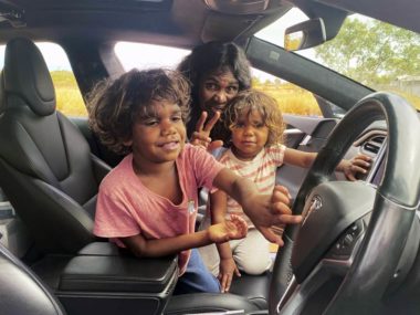 Serena and the kids check out the Tesla. Image: Mark Tipping