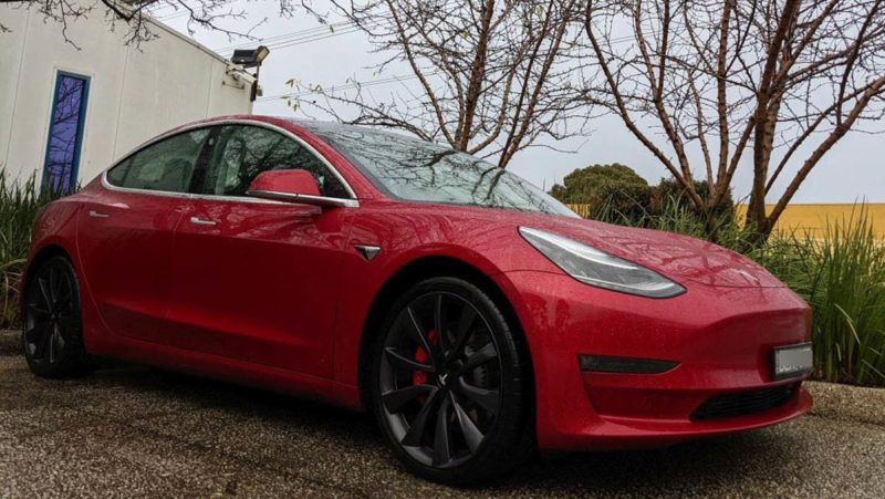 tesla model 3 in the rain