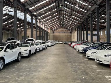 Model Ys and Model 3s lined up in Tesla's warehouse at Alexandria, Sydney. Image: Sam Parkinson