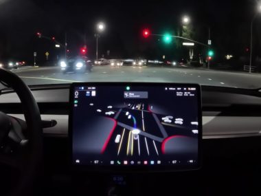 Tesla FSD making left turn through intersection