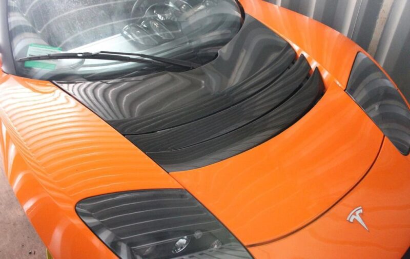 Tesla Roadster Orange Front via Gruber Motors