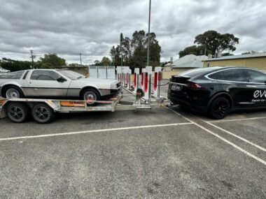Tesla towing electric Delorean