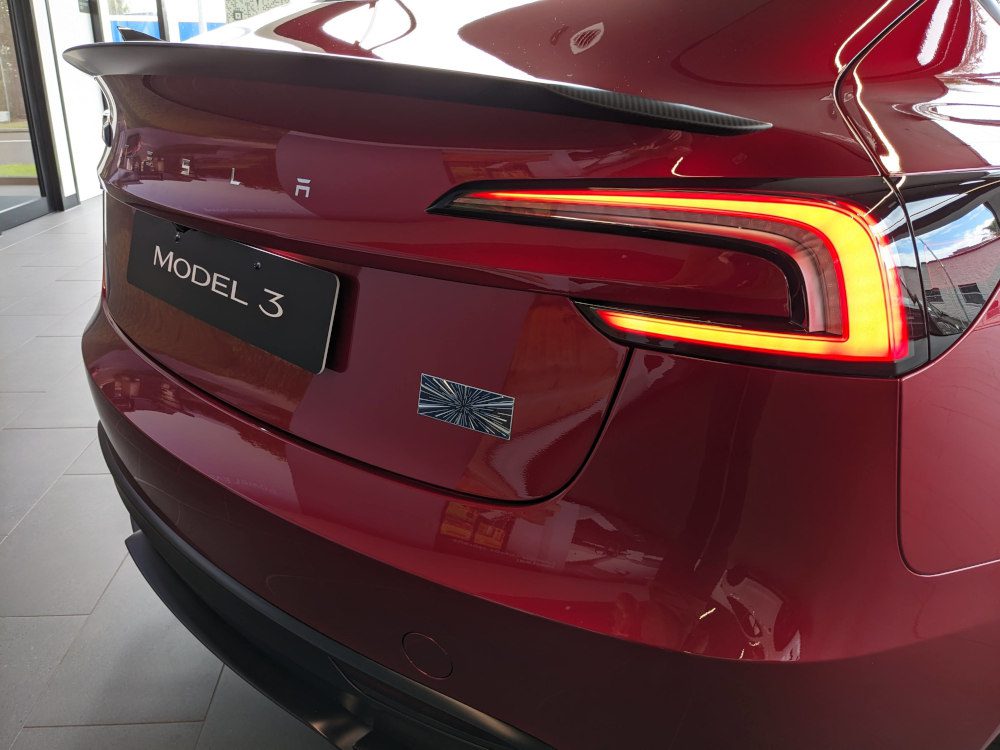Rear of the new Model 3 Performance showing the spoiler, diffuser and Ludicrous badge. Image: Tim Eden