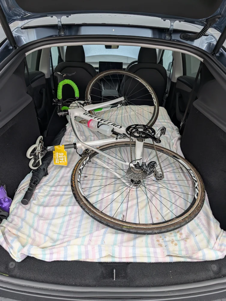 Folding the Model Y seats and fitting a bike in was easy, wheels and all. Image: Tim Eden