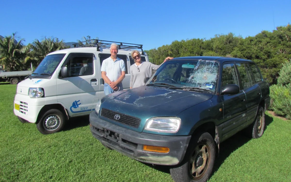 Chris and Margaret Murray with their old Toyota RAV4 and new Mitsubishi iMiEV. Source: Chris Murray
