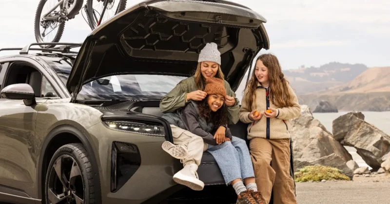 Lucid Gravity frunk, with people enjoying the frunk seat. Source: Lucid Motors