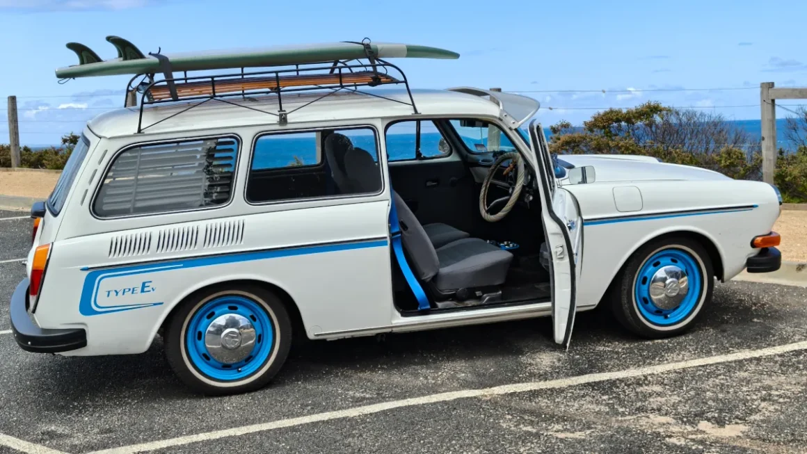 Voltwagen with door open, matching seatbelts and paint highlights. Source: Andy Spry